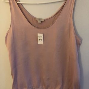 Sleeveless Pink Champagne blouse with ruffle bottom